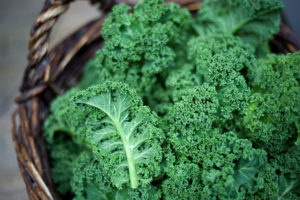 Kale, a super-veggie, is shown in a basket.